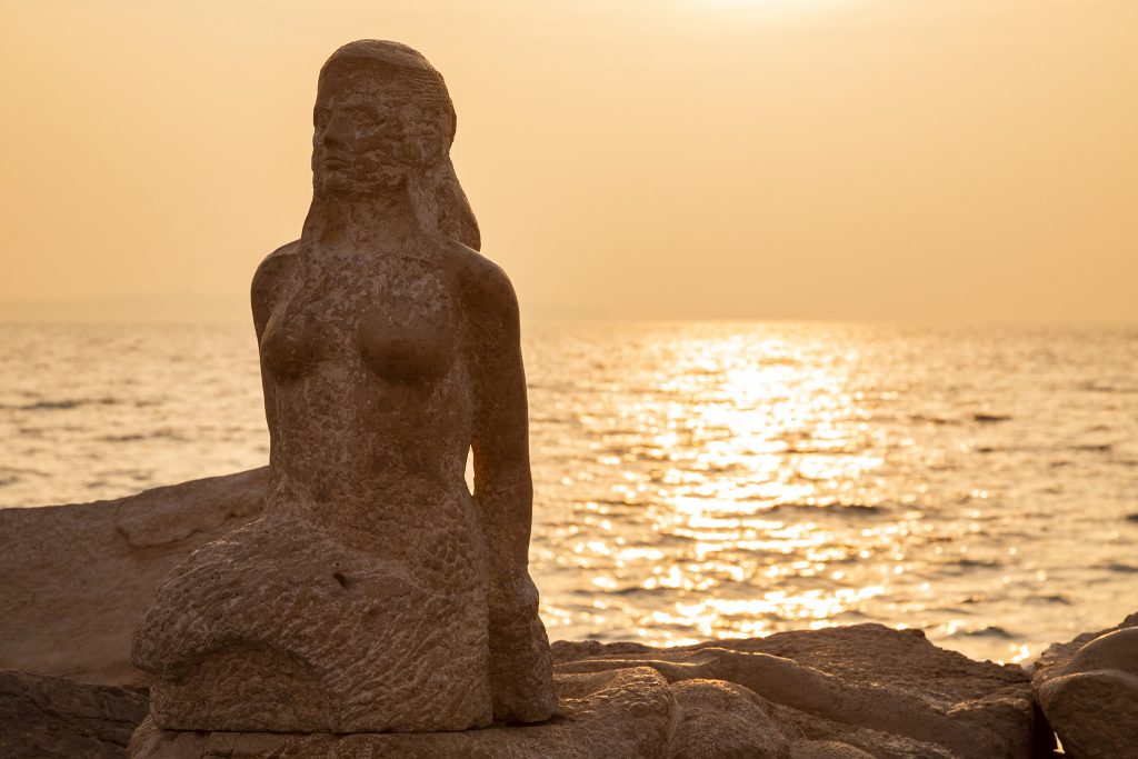 mermaid on the rocks at Piran, Slovenia.