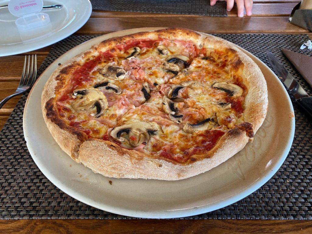 Pizza at Pizzeria Porto Konoba in Obala, Portoroz, Slovenia.